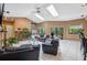 Comfortable living room with tile flooring, plush seating, fireplace, and skylights at 3037 Crest Dr, Clearwater, FL 33759