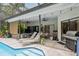 Enjoy outdoor living with this spacious patio, grill, and serene pool area at 3037 Crest Dr, Clearwater, FL 33759