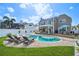 Spacious backyard with a pool, lounge chairs, and well-manicured lawn at 311 22Nd St, Belleair Beach, FL 33786