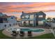 Inviting backyard with a private pool, spacious patio, comfortable lounge chairs, and outdoor dining area at 311 22Nd St, Belleair Beach, FL 33786