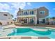 Beautiful backyard with a pool, deck, and outdoor dining area, ideal for entertaining at 311 22Nd St, Belleair Beach, FL 33786