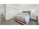Light and airy bedroom showcases a stylish bed, closet, and coordinating nightstands with lamps at 311 22Nd St, Belleair Beach, FL 33786