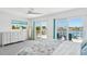 Bedroom with water views and neutral coastal accents at 311 22Nd St, Belleair Beach, FL 33786