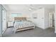 Neutral bedroom featuring a white ceiling fan, matching nightstands and coastal style decor at 311 22Nd St, Belleair Beach, FL 33786