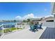 Exterior deck with waterfront views and Adirondack chairs at 311 22Nd St, Belleair Beach, FL 33786