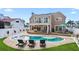 Rear exterior view showcasing the pool, deck, and upper balcony at 311 22Nd St, Belleair Beach, FL 33786