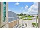 View from the balcony of the surrounding neighborhood on a sunny day with white puffy clouds at 311 22Nd St, Belleair Beach, FL 33786