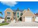 Front exterior showcasing the home's well-manicured lawn, circular driveway, and elegant architectural features at 311 22Nd St, Belleair Beach, FL 33786