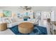 Bright living room with a large sectional sofa, modern decor, and an open floor plan at 311 22Nd St, Belleair Beach, FL 33786