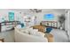 Bright living room featuring a large sectional sofa, modern decor, and open-concept design at 311 22Nd St, Belleair Beach, FL 33786