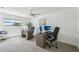 Spacious home office offers plenty of natural light, two workstations, and modern finishes at 311 22Nd St, Belleair Beach, FL 33786