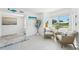 Cozy sitting area with natural light, comfortable seating, and a view of the outdoors at 311 22Nd St, Belleair Beach, FL 33786