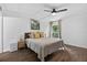 Bedroom with a ceiling fan, wood floor, decorative art and accent pillows at 3325 Bayshore Blvd # A31, Tampa, FL 33629