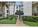 Inviting condo complex entrance with well-manicured landscaping and covered walkway at 3325 Bayshore Blvd # A31, Tampa, FL 33629