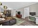 Open-concept living space with a comfortable seating area, study nook, and dining area at 3325 Bayshore Blvd # A31, Tampa, FL 33629