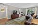 Living room featuring hardwood floors, balcony access, and ample natural light at 3325 Bayshore Blvd # A31, Tampa, FL 33629