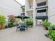 Charming patio area with a bistro set, grill, brick pavers and manicured landscaping for outdoor enjoyment at 3325 Bayshore Blvd # A31, Tampa, FL 33629