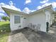Charming back patio featuring a seating area, ideal for relaxing and enjoying the outdoor space at 3515 100Th N Ter, Pinellas Park, FL 33782