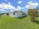Lush backyard with mature landscaping and manicured green lawn at 3515 100Th N Ter, Pinellas Park, FL 33782
