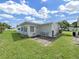 Wide backyard with a patio seating area, offering a private retreat at 3515 100Th N Ter, Pinellas Park, FL 33782
