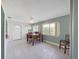 Inviting dining area features tile floors, a ceiling fan, and natural light from surrounding windows at 3515 100Th N Ter, Pinellas Park, FL 33782