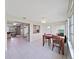 Open dining area seamlessly connects to the kitchen and living space with tile floors and natural light at 3515 100Th N Ter, Pinellas Park, FL 33782