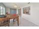 Open-concept dining area with tile floors, connects the living room and kitchen seamlessly at 3515 100Th N Ter, Pinellas Park, FL 33782