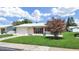 Charming single-story home with a well-manicured lawn and colorful red shutters at 3515 100Th N Ter, Pinellas Park, FL 33782