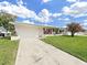 Charming single-story home with a well-manicured lawn and colorful red shutters at 3515 100Th N Ter, Pinellas Park, FL 33782