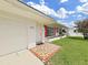 Inviting front exterior with red shutters, mosaic tile entryway and well-maintained lawn at 3515 100Th N Ter, Pinellas Park, FL 33782