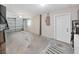 Spacious two car garage with neutral walls, concrete floors and a door to the house at 3515 100Th N Ter, Pinellas Park, FL 33782