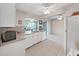Bright kitchen offers white cabinets, appliances, tile flooring, and eat-in dining area at 3515 100Th N Ter, Pinellas Park, FL 33782