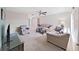 Spacious living room with a ceiling fan, comfortable seating, and ample natural light at 3515 100Th N Ter, Pinellas Park, FL 33782