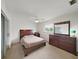 Spacious main bedroom features wood furniture and sliding glass door to the outside at 3515 100Th N Ter, Pinellas Park, FL 33782