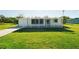 Single-story home exhibiting a well-kept lawn and inviting curb appeal at 3614 Vasco St, Punta Gorda, FL 33950
