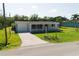 Charming single-story home with a well-maintained lawn and mature trees at 3614 Vasco St, Punta Gorda, FL 33950