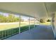 Spacious covered front porch with white railings, perfect for relaxing outdoors at 3614 Vasco St, Punta Gorda, FL 33950
