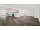 Spacious living area featuring modern gray wood floors and an open layout at 3614 Vasco St, Punta Gorda, FL 33950