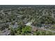 An aerial view of a home in a lush, tree-filled neighborhood with a defined property line for reference at 3617 E Louisiana Ave, Tampa, FL 33610