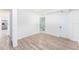 An empty room featuring wood-look floors with fresh white walls at 3617 E Louisiana Ave, Tampa, FL 33610