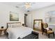 Bedroom with bed, chair, and large mirror at 3814 W Sevilla St, Tampa, FL 33629