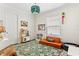 Bright bedroom with a play area featuring unique light fixture and built-in shelving offering room to play at 3814 W Sevilla St, Tampa, FL 33629