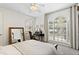 Bright bedroom with large windows and desk at 3814 W Sevilla St, Tampa, FL 33629