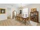Elegant dining room with large table, chandelier, floor-to-ceiling mirror, and hardwood floors at 3814 W Sevilla St, Tampa, FL 33629