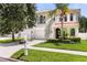 Beautiful two-story home with manicured lawn, mailbox, attached garage, and red-tile roof at 3814 W Sevilla St, Tampa, FL 33629