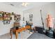Bright home office with custom bookshelves, desk and work space with gym equipment at 3814 W Sevilla St, Tampa, FL 33629