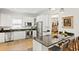 Modern kitchen with stainless steel appliances, black countertops, and bar seating at 3814 W Sevilla St, Tampa, FL 33629