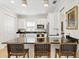 Kitchen with granite island, stainless steel appliances, and ample cabinet space at 3814 W Sevilla St, Tampa, FL 33629