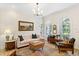 Bright living room featuring comfortable seating and abundant natural light from the arched windows at 3814 W Sevilla St, Tampa, FL 33629