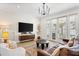 Modern living room with large windows and comfortable seating at 3814 W Sevilla St, Tampa, FL 33629